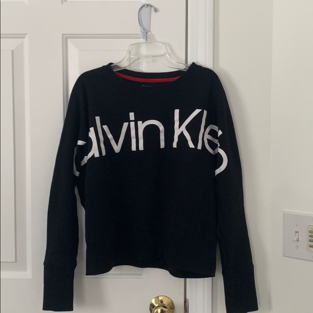 Woman’s black Calvin Klein sweatshirt
